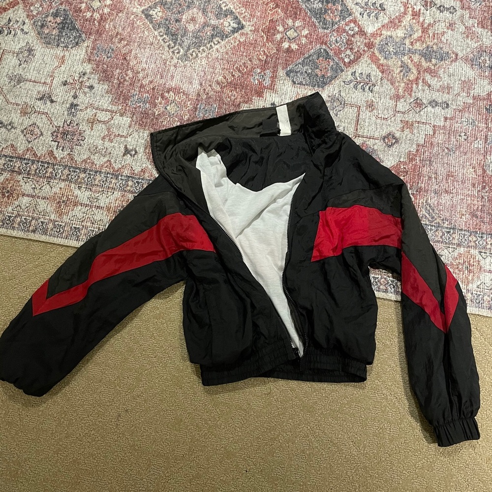 black and red jacket/windbreaker